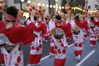 Picture of traditional dancing taking place during a festival in the Tobu region