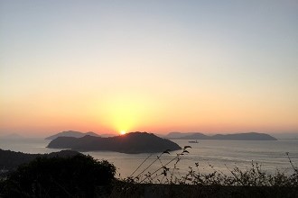 Sunrise Over the Ocean and Distant Islands