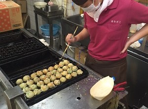 Takoyaki Chef Making Takoyaki with Cooking Utensil